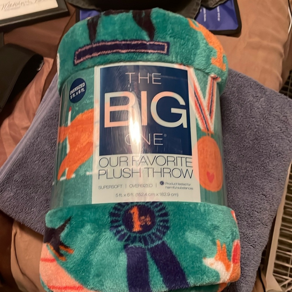The big one throw blanket with dogs and dog shoe images